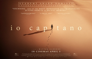 Poster for Io Capitano, a lone person walking through a vast desert. The figure replaces the i in the word Capitano in the title.