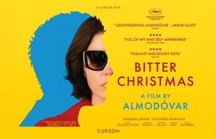 A vibrant poster for Bitter Christmas, featuring a woman in sunglasses against a bold yellow-and-blue background, with the film title and Almodóvar’s name prominently displayed.
