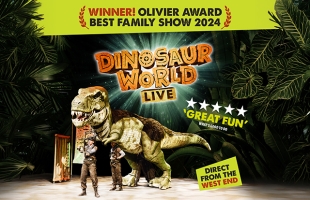 Promotional image for Dinosaur World Live stage show. A large realistic dinosaur puppet stands on a theatre stage beside two performers in safari-style costumes. Text across the image includes “Winner! Olivier Award Best Family Show 2024”, the show title “Dinosaur World Live”, a four-star review quote reading “Great Fun”, and “Direct from the West End”. Tropical jungle leaves frame the scene.