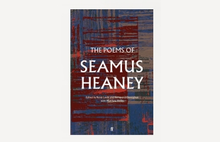 Seán Rocks with his arms crossed, smiling, next to the front cover of the The Poems of Seamus Heaney