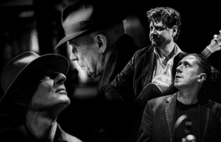 Black and white collage image of Steward D'Arietta wearing a fedora, surrounded by his bandmates.