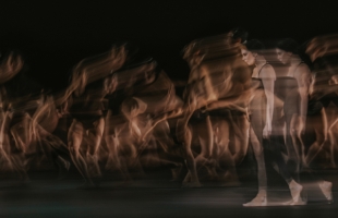 An image depicting the rapid movement of one female dancer