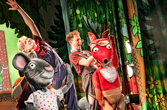 Scene from Tales From Acorn Wood, Fox and Rabbit are pictured together on stage