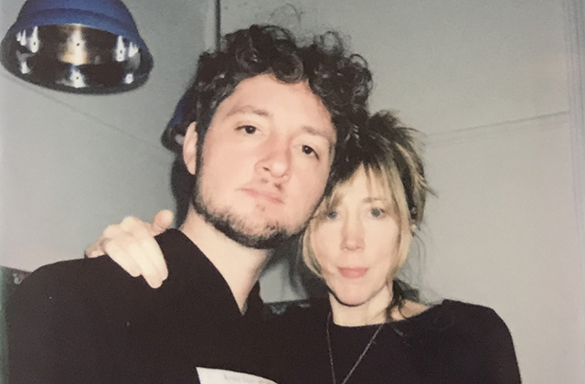 Sam Amidon and Beth Orton, dressed in black, pose for a candid photo with their arms around each other