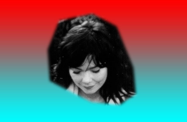 A black & white photo of Bjork is placed against a two tone blue and red background. She is looking towards the ground with a smile on her face.