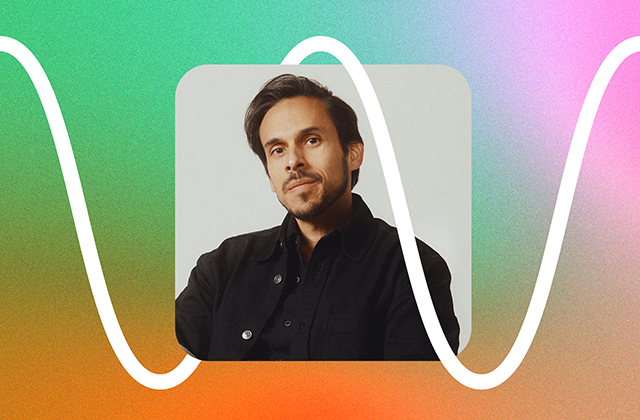 Portrait of a man with dark hair and light stubble wearing a black jacket and shirt, posed inside a rounded square frame. A thick white wavy line crosses in front of the image on a grainy gradient background blending green, teal, orange, and pink tones, giving the composition a modern, graphic design style.