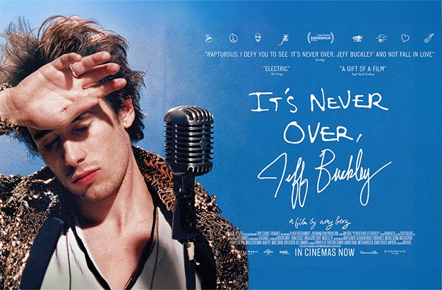 Poster-style image of a young male singer standing at a vintage microphone, eyes closed and hand raised to his forehead as if shielding light. He wears a textured jacket and looks introspective. Blue background with handwritten-style title text reading “It’s Never Over, Jeff Buckley,” along with film quotes and release information.