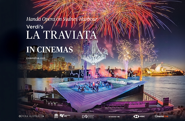 Promotional poster for Handa Opera on Sydney Harbour's production of Verdi’s La Traviata in Cinemas. The image features a outdoor stage built over Sydney Harbour at night, with performers dancing on an inclined, framed platform. Above the stage hangs a massive glowing chandelier beneath red and gold fireworks filling the sky. In the background, illuminated city skyscrapers, the Sydney Opera House, and the Harbour Bridge are visible across the water.