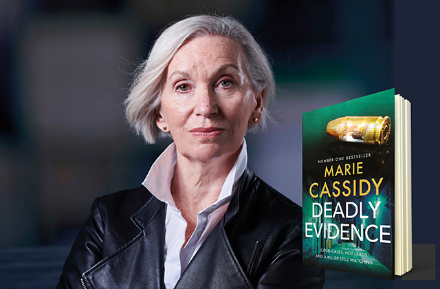 Marie Cassidy, wearing a black leather jacket, stands with her arms crossed