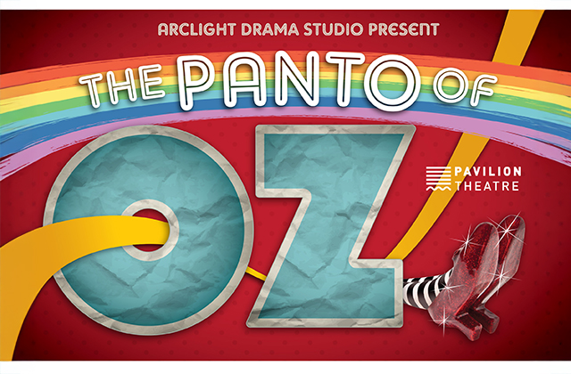 Poster for The Panto of Oz presented by Arclight Drama Studio at Pavilion Theatre. The title features a large blue “OZ” with a yellow brick road curving through it, a rainbow overhead, and the Wicked Witch’s striped legs and red shoes peeking out from the side on a red background.