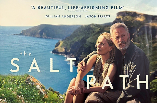 Poster for The Salt Path. An older couple sit with their arms around each other atop a mountain, overlooking a cove