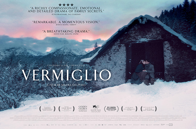 Poster for Vermiglio. A young couple sit in the door way of of a small cabin, kissing. It is positioned on a snowy mountain, with thick snow all around.